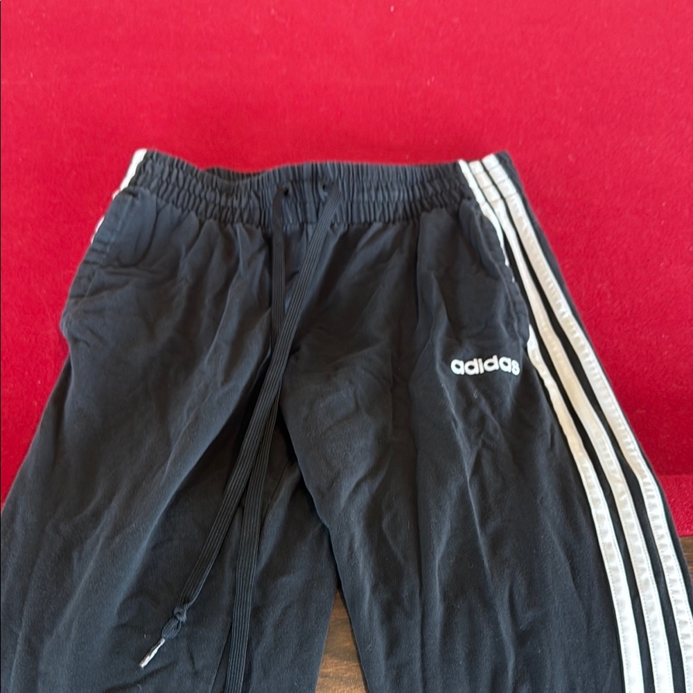 Adidas Black Sweatpants with Signature Stripes and Relaxed Fit